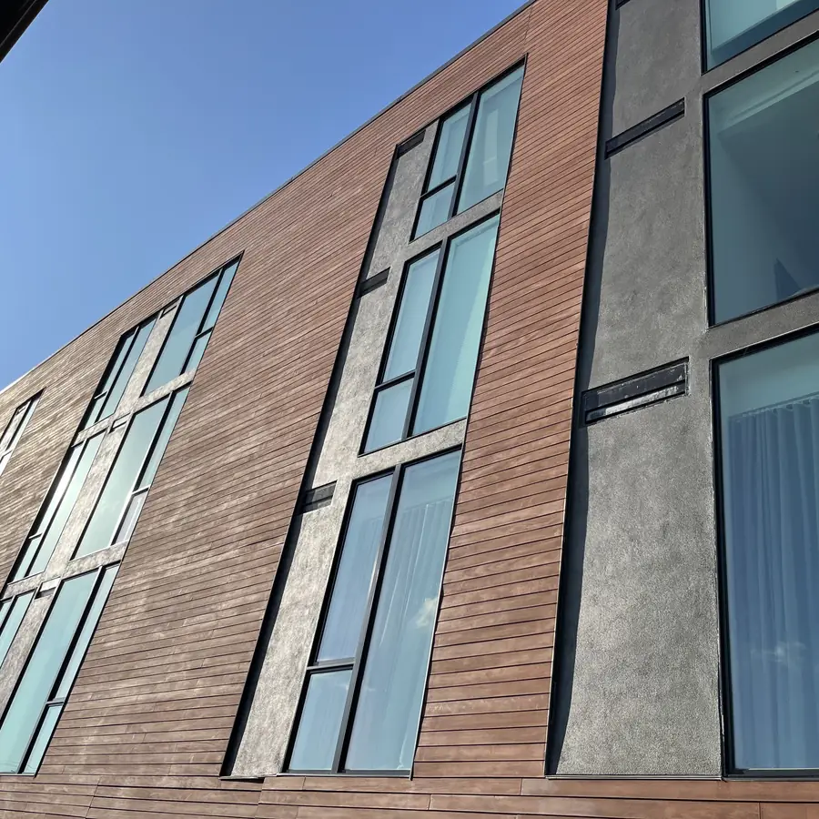 Full height windows and wood cladding on a modern Austin building, cleaned