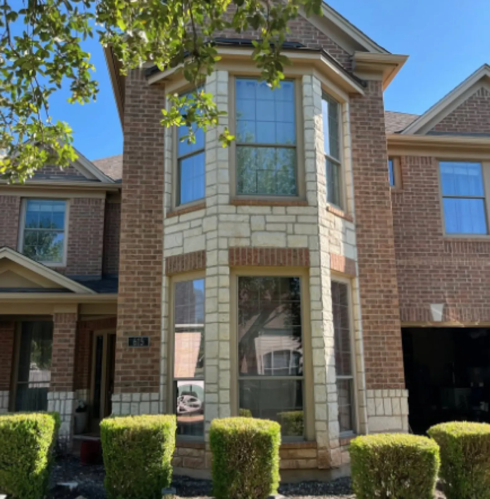 Texas brick home with cleaned bay windows