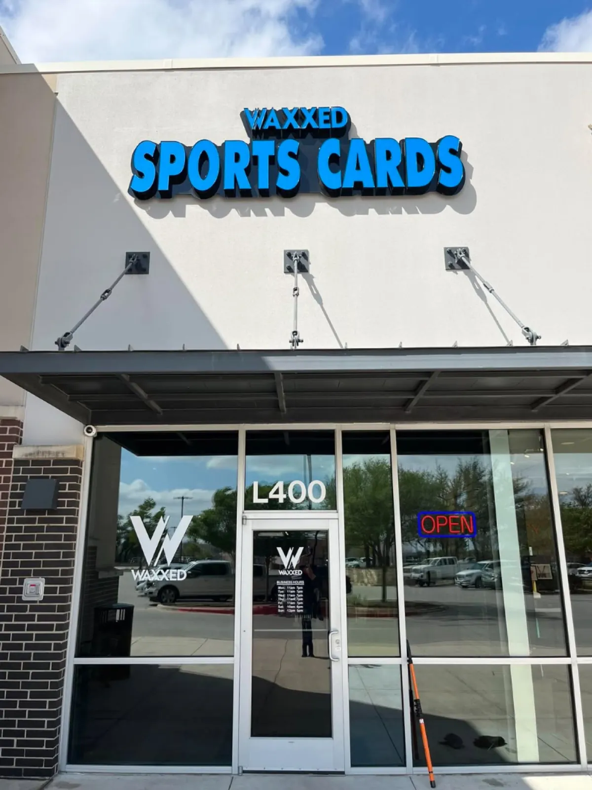Waxxed Sports Cards storefront windows cleaned