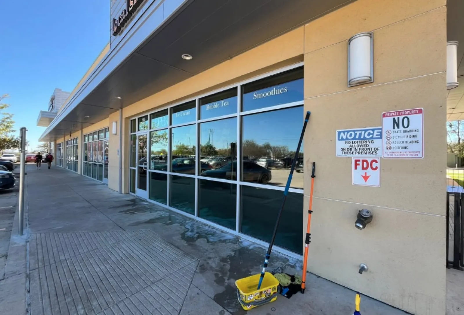 Retail strip-center storefront windows cleaned