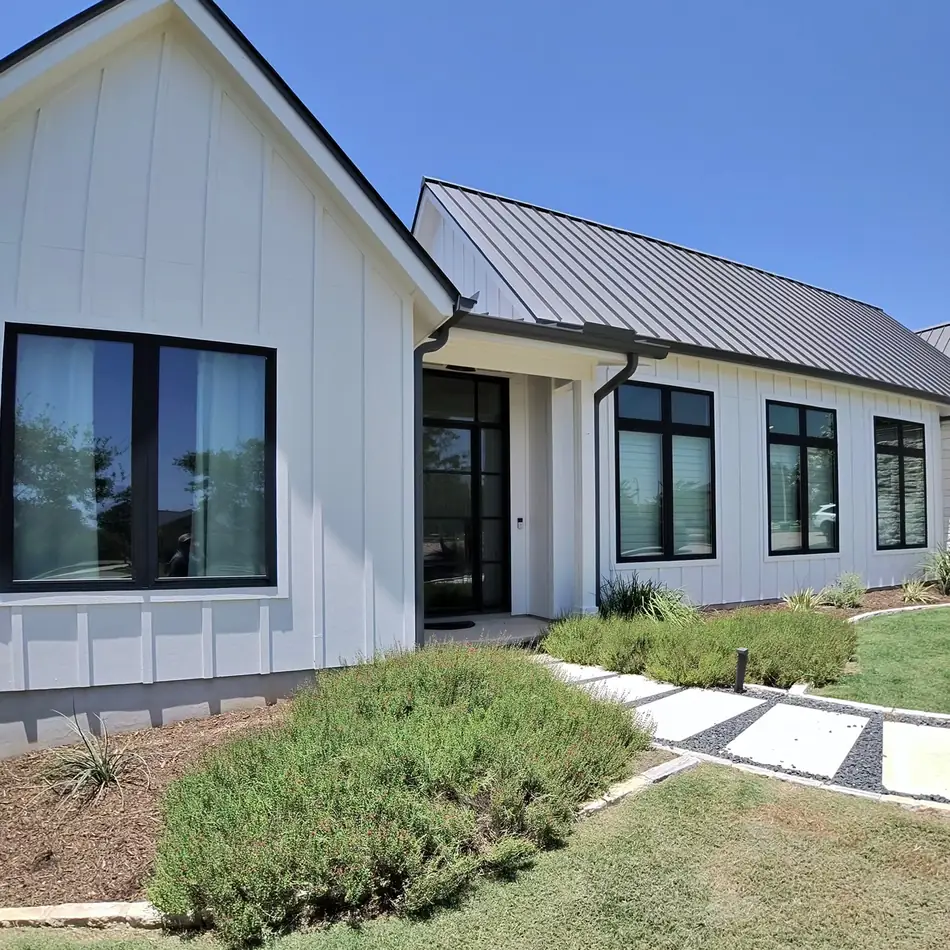 White modern farmhouse with black framed windows