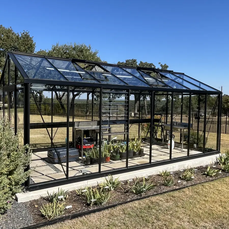 Glass greenhouse in a Georgetown garden, every pane cleaned inside and out