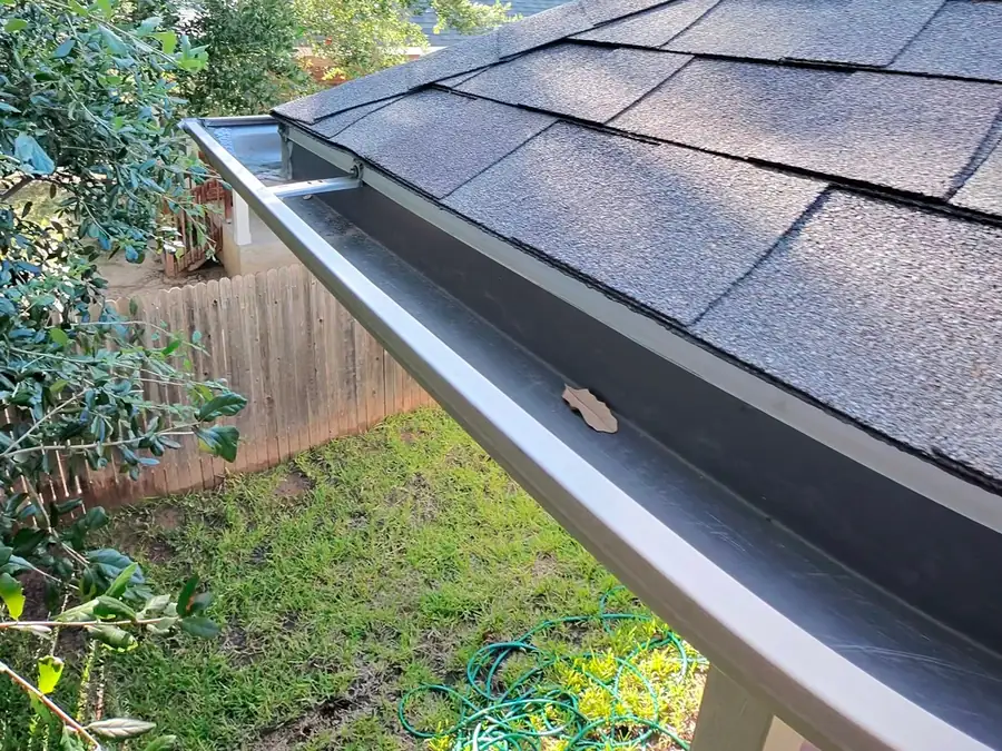 The same gutter system cleared back to bare metal with the channel completely open